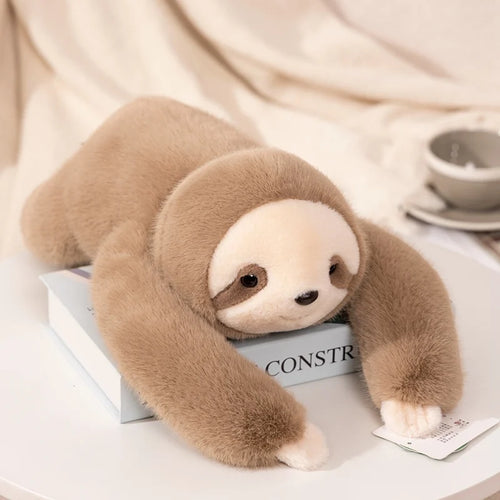 Wilder the Sloth, a sand-colored plush sloth, Hearth & Hush