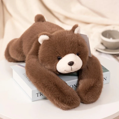 Bram the Bear, a brown plush bear lying on its belly, Hearth & Hush